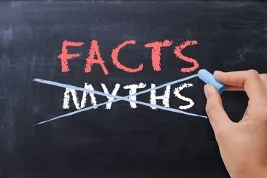 A chalkboard with the word "MYTHS" crossed out and replaced by "FACTS," symbolizing the act of debunking or correcting myths.