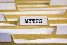 A filing system with a tab labeled "MYTHS," symbolizing the categorization or investigation of myths.